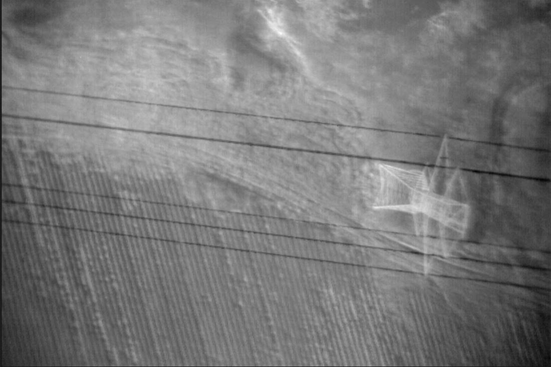 A thermal image of a power transmission line from an infrared sensor